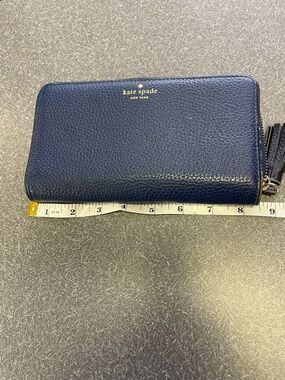kate spade pebbled navy zip-around wallet with tassel